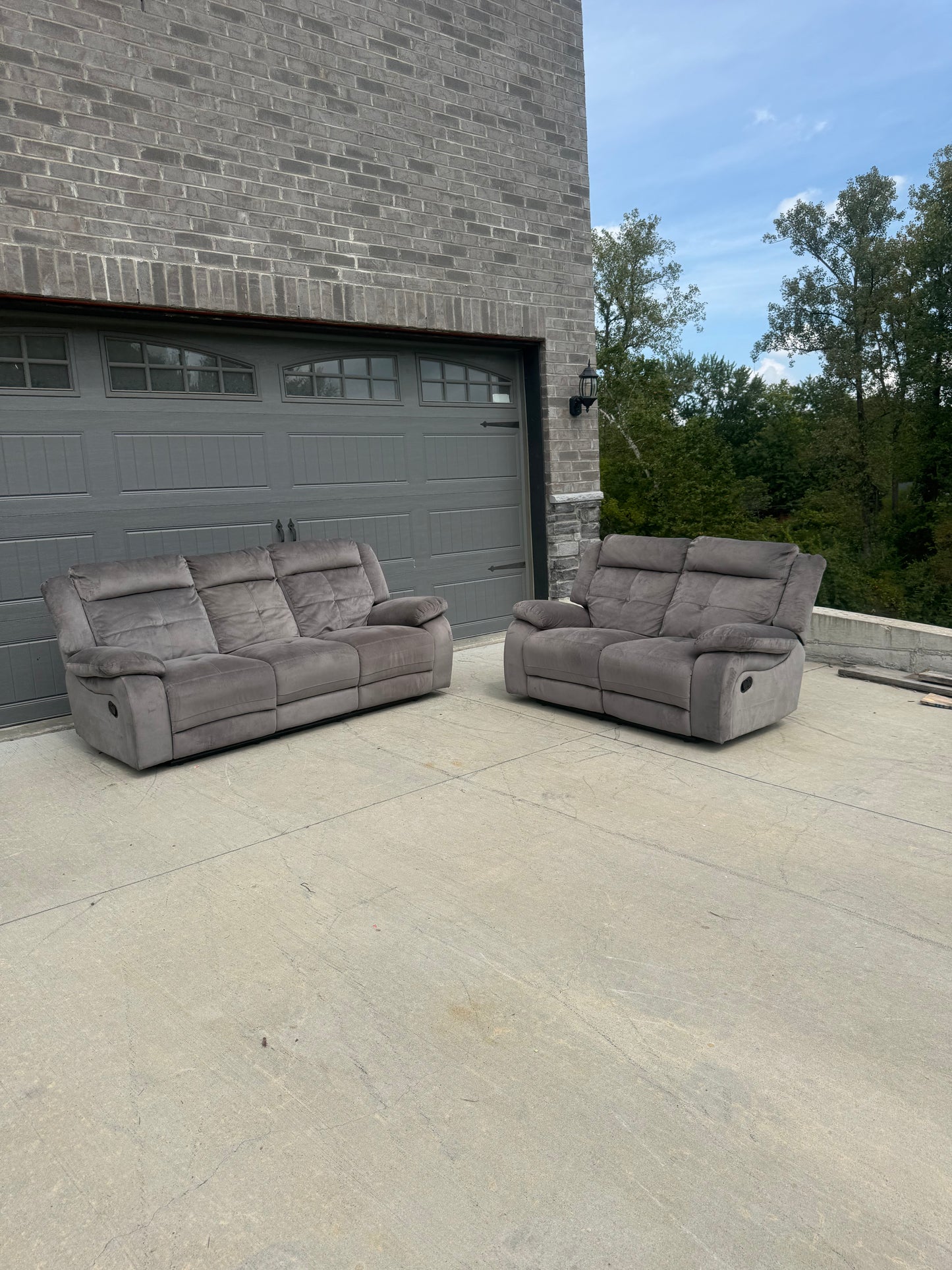 Grey reclining couch and loveseat set